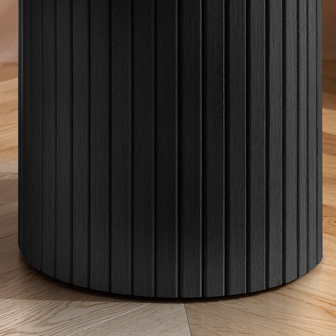 close up image on cylindrical fluted base of black side table
