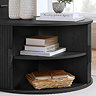 close up image of round black coffee table with door open to show shelving within