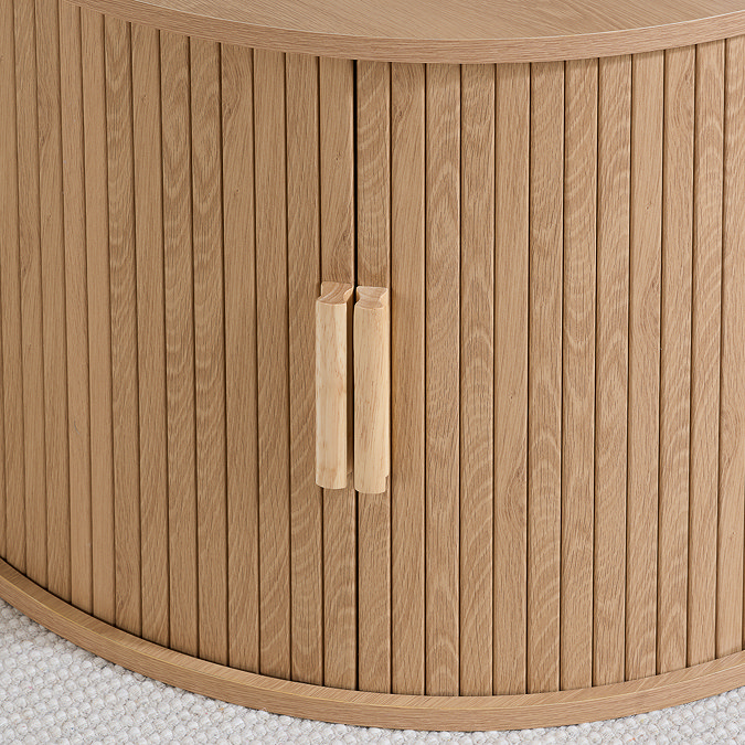 close up image on fluted doors of round storage coffee table