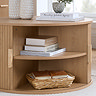 image of round fluted coffee table with two doors open to show shelves inside