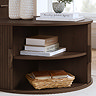 close up image of walnut brown round coffee table with doors pulled open to show shelf space within