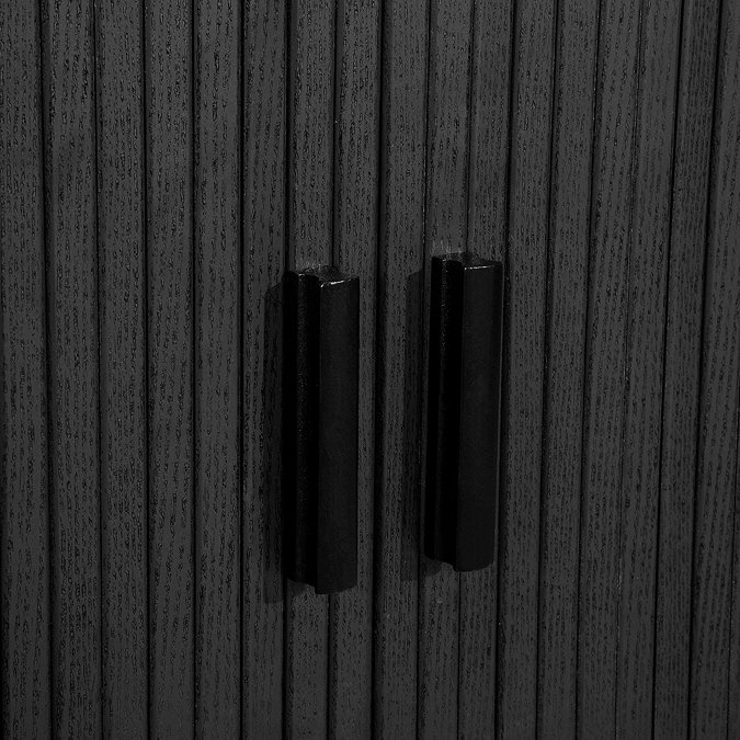 close up image of handles on fluted black wood effect sideboard