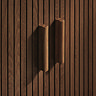 close up on wooden handles of closed walnut drawers with fluted detail