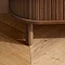 close up on foot of walnut coloured sideboard