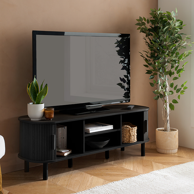 image of black wood effect tv stand with fluted doors pulled open to show shelf and compartment space within