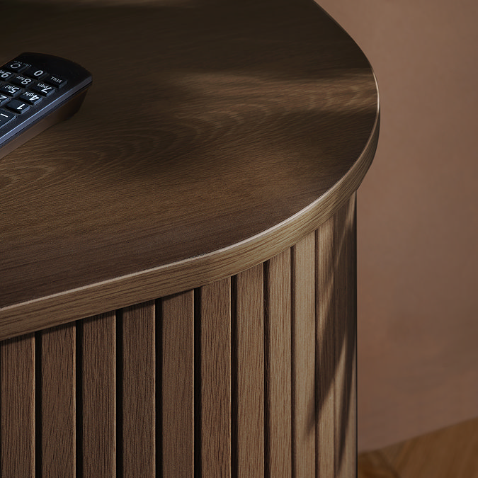 close up image of smooth wood top of fluted walnut tv unit