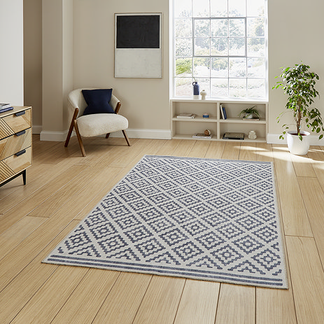 Coral rug in blue on floor image 1