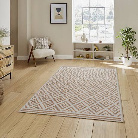 Coral yellow rug on floor image 1