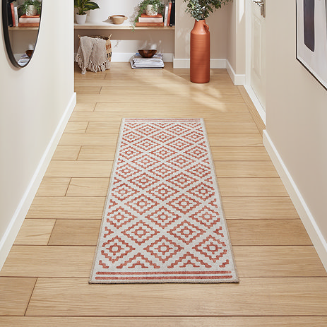 Coral orange runner on floor image 1