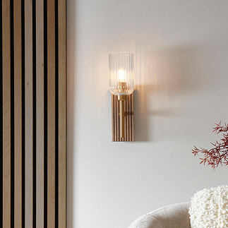 image of curved ribbed light shade with brass arm and dark beechwood backplate