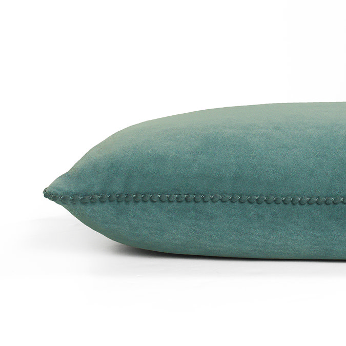 close up image on side of blue-green rectangular cushion with bobbled edge