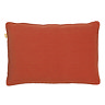 image cut out on white background of brick orange rectangular cushion with tiny pom-pom edges