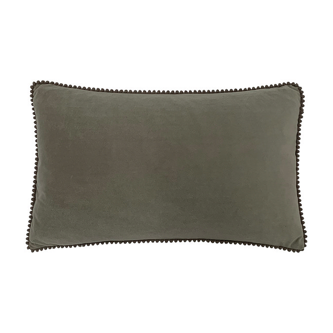 image cut out on white background of grey rectangular cushion edged with tiny pom poms