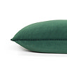 close up image of marine-green cushion edged with pompoms