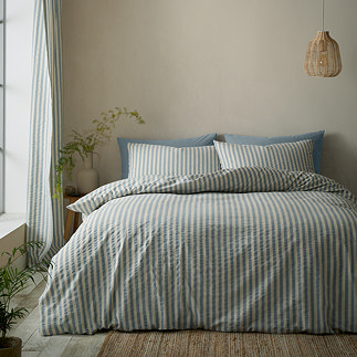 Cotton rich woven stripe blue on bed image 1