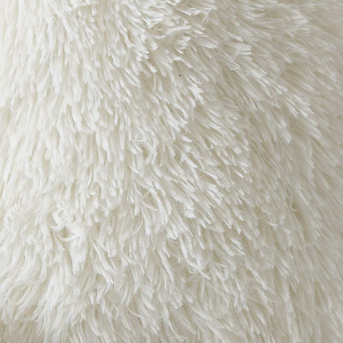 Cuddly shaggy faux fur chair cushion in cream texture close up image 2
