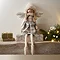 decorative angel with cream tartan dress and white wings sitting on the mantlepiece