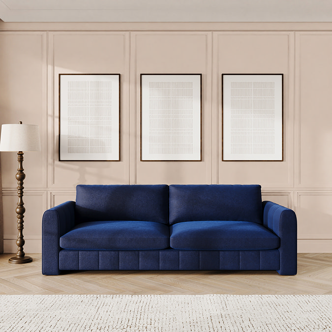 lifestyle image of indigo blue velvet contemporary grand sofa
