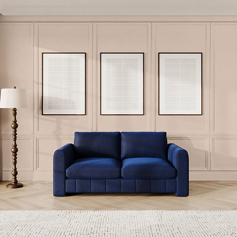 lifestyle image of indigo blue contemporary medium sofa