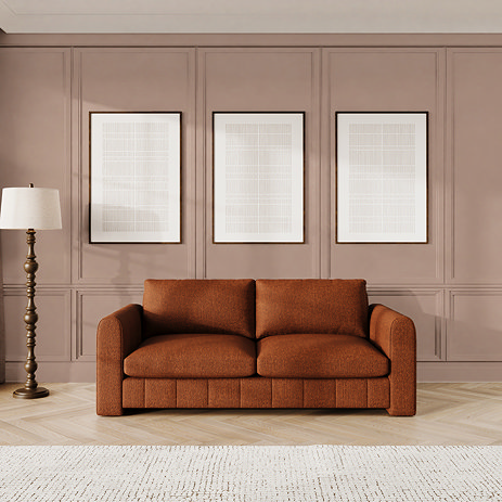 lifestyle image of mandarin coloured contemporary large sofa