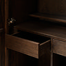 close up image on the inside of dark oak drinks cabinet with one of two inner drawers pulled out