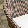 close up image on wicker material of garden seat