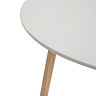 close up image of smooth white seat and acacia wood legs of outdoor table