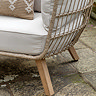 close up image of light wood feet of garden egg chair