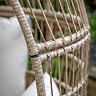 close up image on wicker frame of rounded garden egg chair