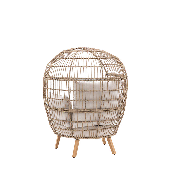 cut out image taken from the back of rounded wicker garden egg chair with light wood legs and cream cushions