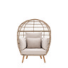 cut out of round wicker egg chair with plush cream cushions