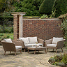 image of 5 seat wicker lounge set on patio of country garden