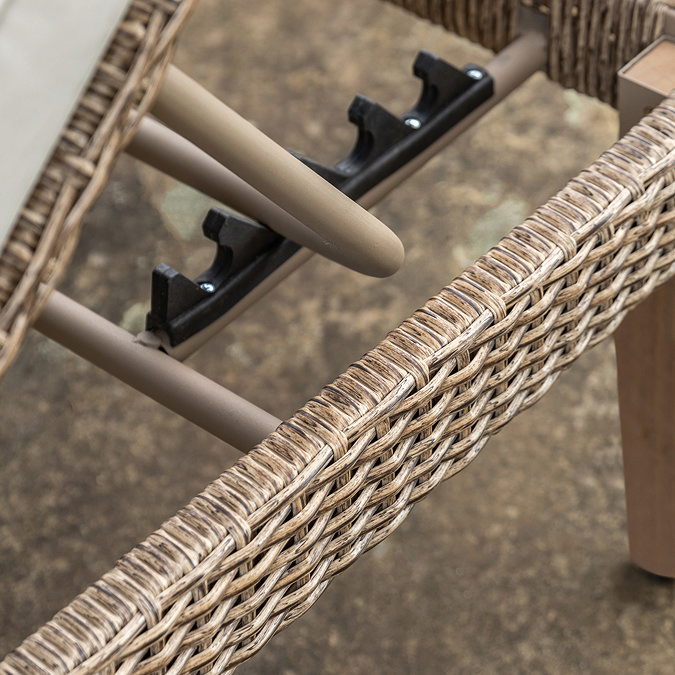 close up image of wicker side of sun lounger, showing adjustable mechanism underneath