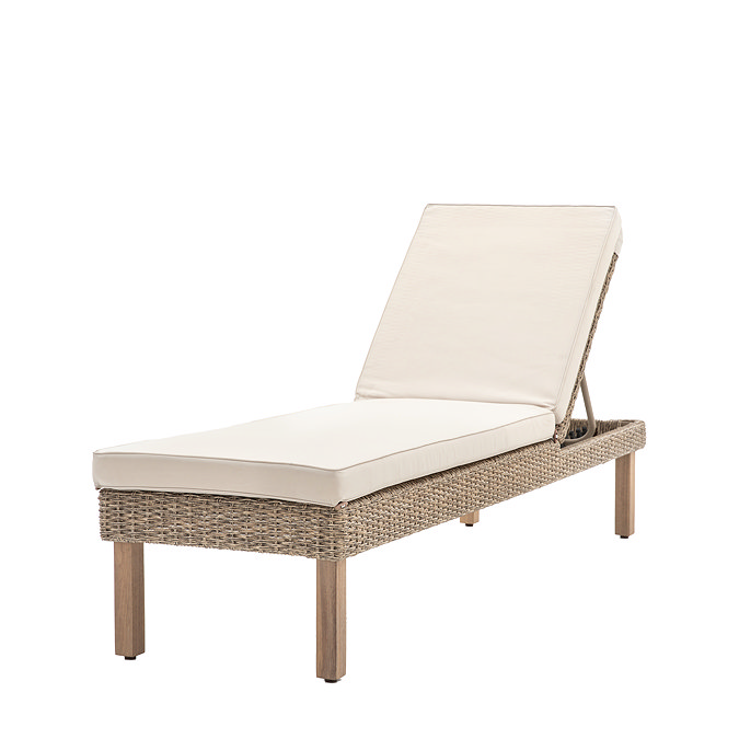 image cut out on white background of wicker sun lounger with cream cushion