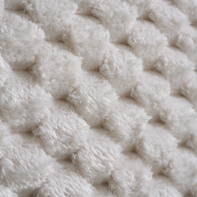 close up zoomed in image of faux fur bubble effect headboard