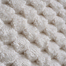 close up zoomed in image of faux fur bubble effect headboard