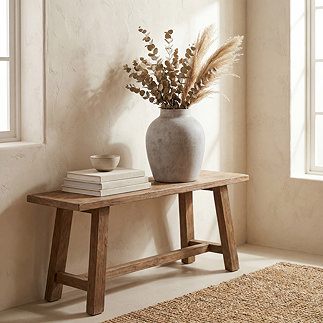 image of grey stone vase on wooden console table