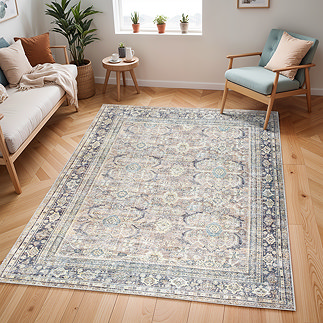 image of blue and brown vintage rug on light wood floor of a modern apartment