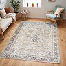 image of vintage floral rug with shades of grey, mauve and brown, on light wood flooring of modern apartment