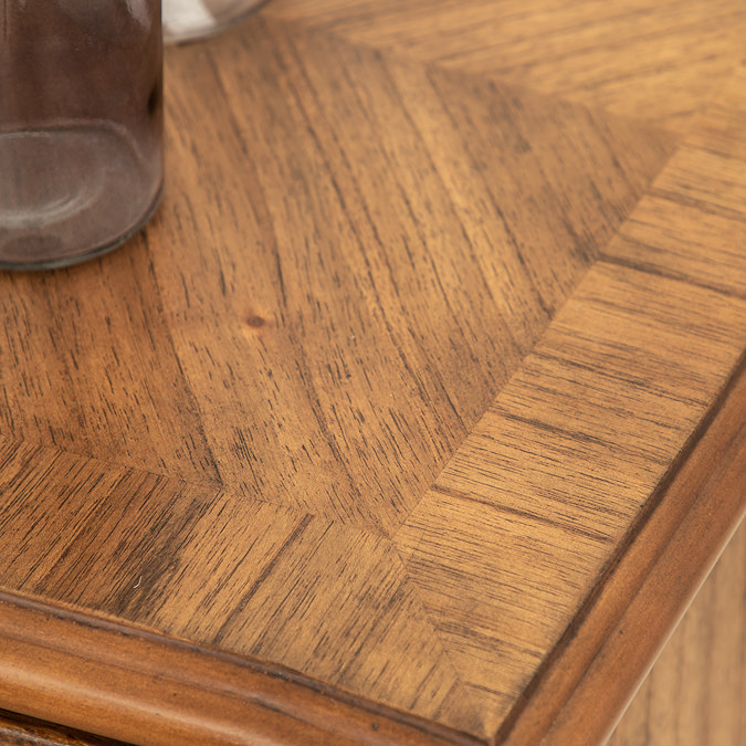 close up on top of mindi wood finish of sideboard
