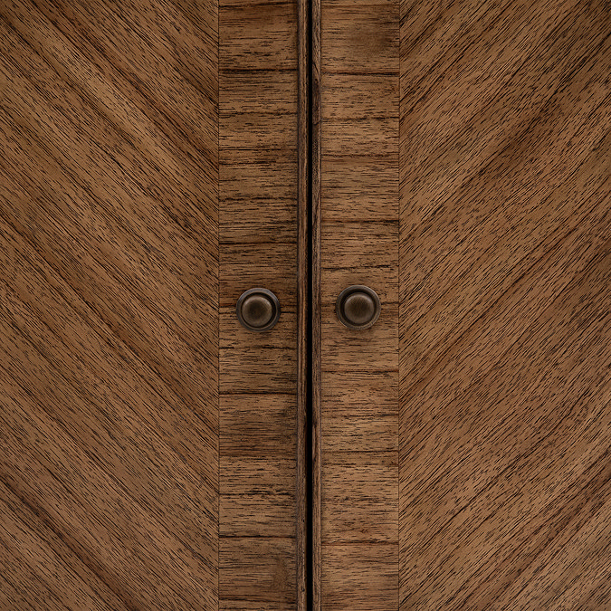 close up on doors of sideboard with small bronze handles