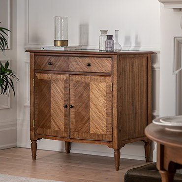 close up image on mindi wood finish of sideboard, with bronze beehive pull handles on the drawer