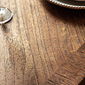 close up image of natural wood of tabletop, in brown finish