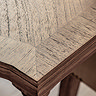 close up image on corner of rectangular mindi wood dining table