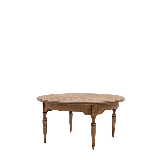image cut out on white background of round solid wood coffee table with thin legs