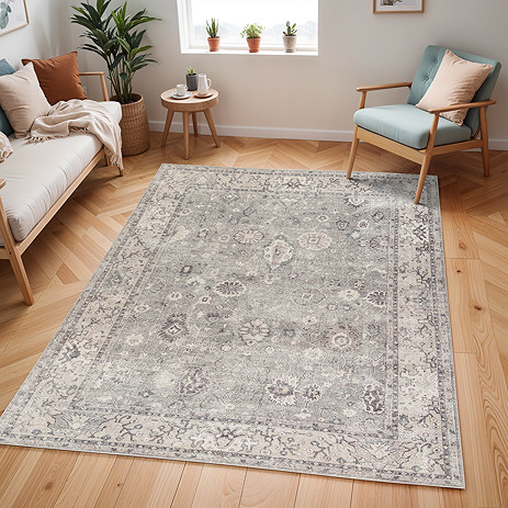 image of vintage floral grey rug on light wood flooring of modern apartment