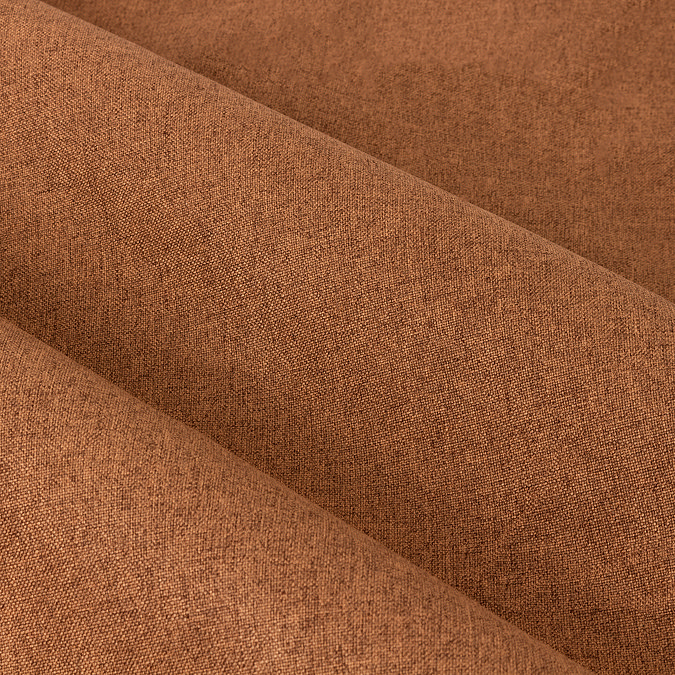 Close up of dark orange blackout curtains texture