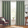 Light green curtains open in front of living room window