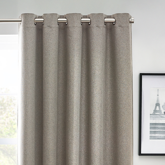 Close up of light grey curtains in eyelet style