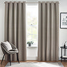 Floor length light grey curtains in front of window